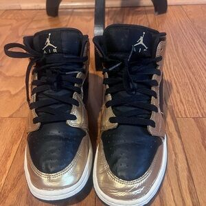 Air Jordan 1 Mid Black and Metallic Gold Sneakers